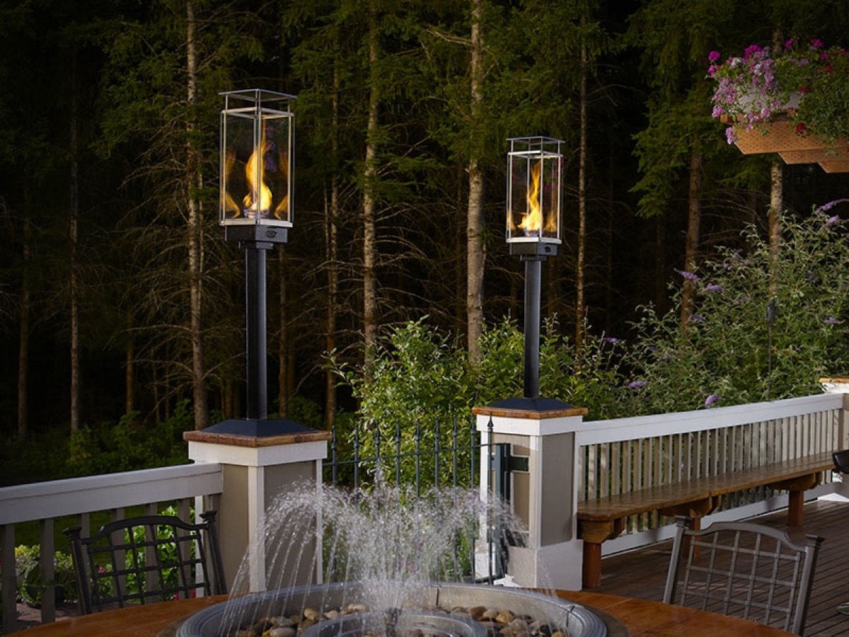 Travis Fire Garden Tempest gas torch on a porch post